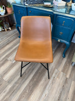 Whiskey brown faux leather chairs